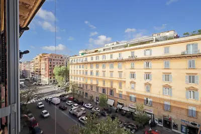 a view of a city street with cars and buildings at 4BNB - Leone IV Apartment in Rome