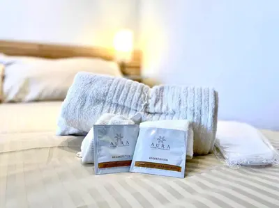 two towels and pillows on a bed in a bedroom at Al Mamalo Rome Luxury Apartment in Rome