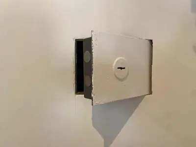 a light switch on the side of a wall at Al Mamalo Rome Luxury Apartment in Rome