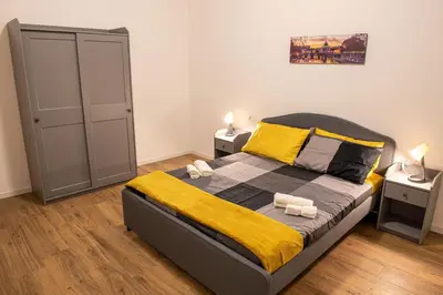 a bedroom with a bed with two towels on it at Locazioni Ostiense - Domus William in Rome