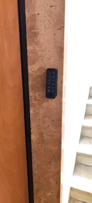 a remote control sitting on the floor next to some stairs at Locazioni Ostiense - Domus William in Rome