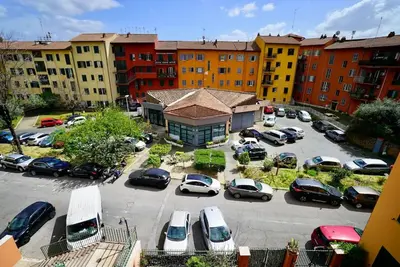 an aerial view of a parking lot with parked cars at (9)Nine stops from the Colosseum in Rome