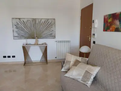 a living room with a couch and a table at La casa di Gloria in Rome