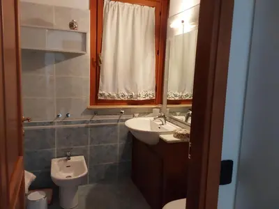 a bathroom with a sink and a toilet at La casa di Gloria in Rome