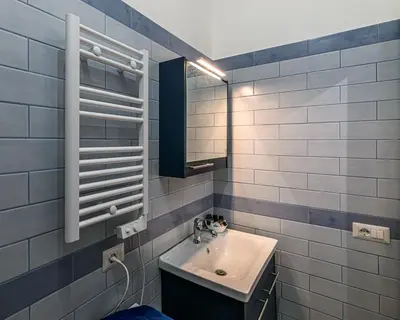 a bathroom with a sink and a mirror at Belle Arti home in Rome