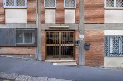 a brick building with a door on the side of it at Belli Suites Vatican Rome Guest House in Rome