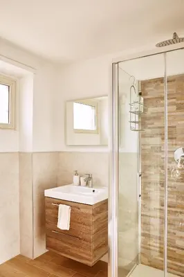 a bathroom with a sink and a shower at Monteverde Suite Apartment in Rome