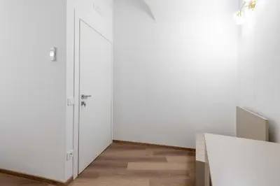 a room with white walls and a white door at ELICAL Vatican Suites in Rome