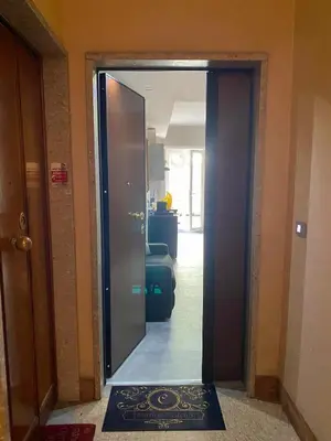a door leading into a room with a hallway at Domus Carola in Rome