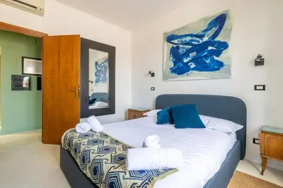 a bedroom with a bed with towels on it at Spacious with terrace 3 bedroom, metroA Battistini in Rome