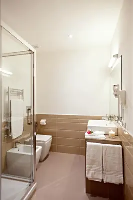 a bathroom with a sink and a toilet and a tub at LaHouse Rome by Premium Suites Collection in Rome
