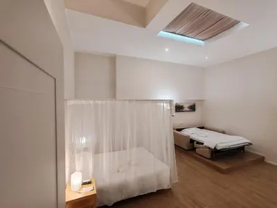 a hospital room with a bed and a shower at Charme & Chic Nazionale in Rome