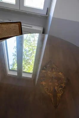 a glass table in a room with a window at Dimora Malatesta @ The Vatican in Rome