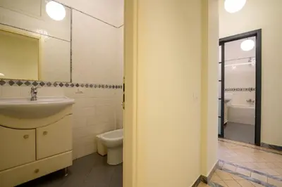 a bathroom with a sink and a toilet and a shower at Quattro Cantoni Apartment Monti in Rome