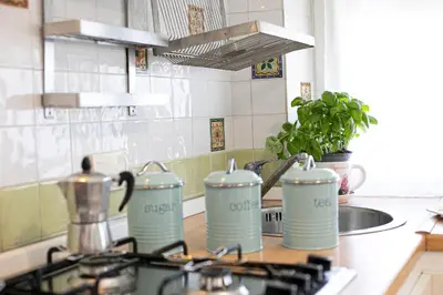 a kitchen counter with a stove top with at Alchimia Friends and Family 3 bedrooms 3 bathrooms in Rome