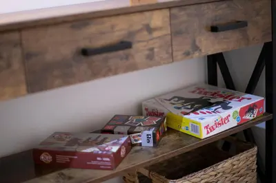 three pizzas sitting on a shelf under a desk at Alchimia Friends and Family 3 bedrooms 3 bathrooms in Rome