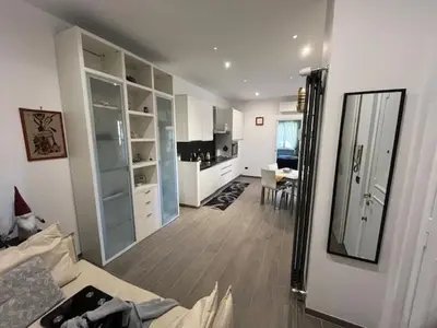 a large room with a kitchen and a living room at Casa Dalia in Rome