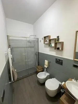 a bathroom with a shower and a toilet and a sink at Casa Dalia in Rome