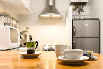 two cups of coffee on a table in a kitchen at Central near Piazza Navona by NDP rent in Rome