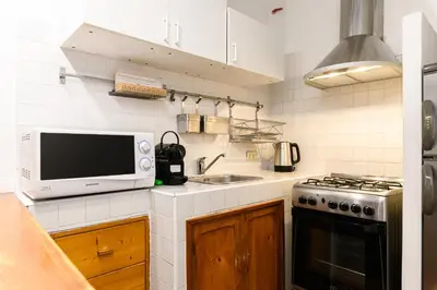 a kitchen with a microwave and a sink at Central near Piazza Navona by NDP rent in Rome