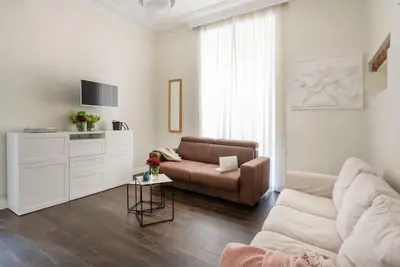 a living room with a couch and a table at Luxury Blu Rome in Rome