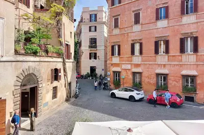 a view of a street with two cars and buildings at YCH-Casa Bella- Luxury home near Piazza Venezia in Rome