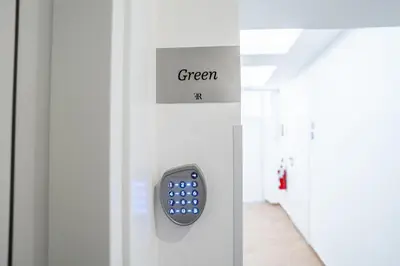 a remote control on a door with the word green at Fantini Rooms-Monti in Rome