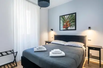 a bedroom with a bed with two towels on it at Allegra Domus in Rome