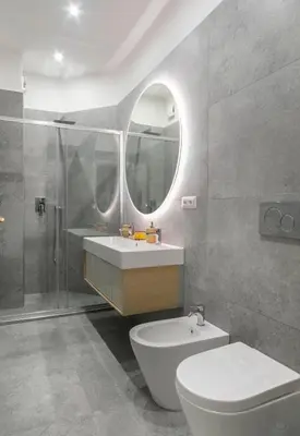 a bathroom with a sink and a toilet and a mirror at Allegra Domus in Rome