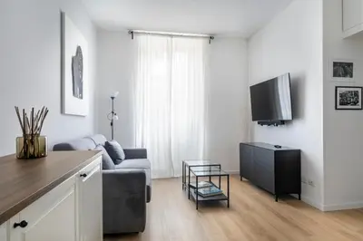 a living room with a couch and a tv at Allegra Domus in Rome