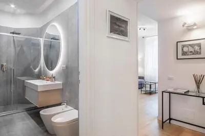 a bathroom with a toilet and a sink and a mirror at Allegra Domus in Rome