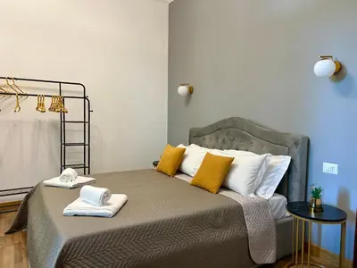 a bedroom with a bed with towels on it at Maison Vaticano in Rome