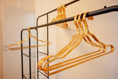 a metal rack with gold bars on it at Maison Vaticano in Rome