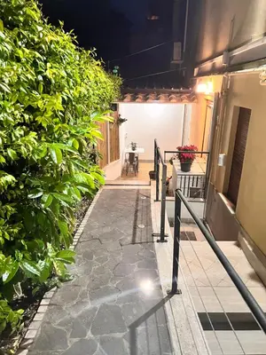 a walkway leading to a patio with plants at Antinori Stresa Home in Rome