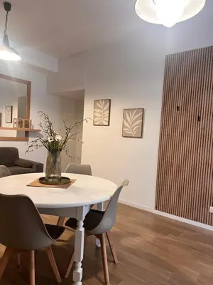 a dining room with a white table and chairs at Antinori Stresa Home in Rome