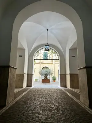 an empty hallway with a large window in a building at Colosseo House in Rome