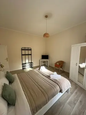 a bedroom with a large bed in a room at Colosseo House in Rome