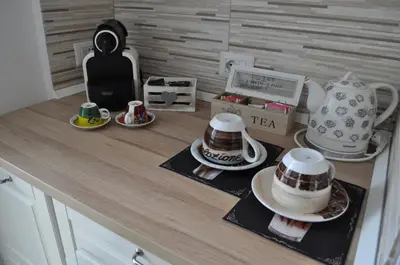 a counter with a tea set on top of it at A casa di Emi e Giò in Rome