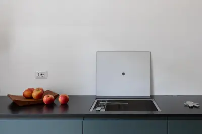 a kitchen counter with apples on a cutting board at iFlat Vatican 2 Bedroom Design Apartment in Rome
