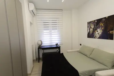 a living room with a couch and a table at Living Testaccio - Modern Apartment in Rome