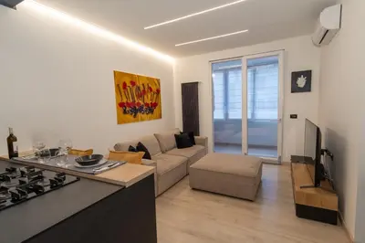 a living room with a couch and a stove at Living Testaccio - Modern Apartment in Rome