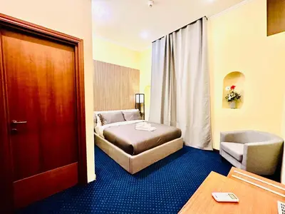 a hotel room with a bed and a door at Hotel Rome place in Rome