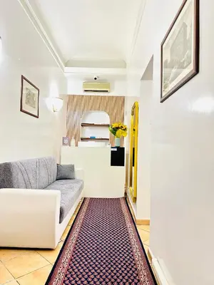 a living room with a couch and a table at Hotel Rome place in Rome