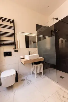 a bathroom with a toilet and a sink and a shower at Villa Borghese Prestige Rooms in Rome