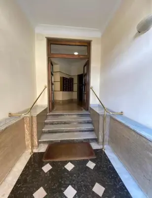 an empty hallway with stairs in a building at Fefe's House in Rome