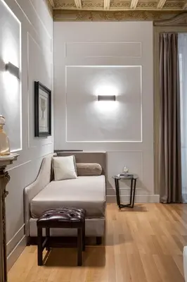 a living room with a couch and a table at Palazzo Goldoni Condotti Collection in Rome