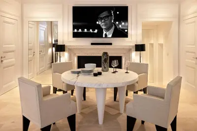 a dining room with a table and chairs and a tv at Viam Villa Futura in Rome