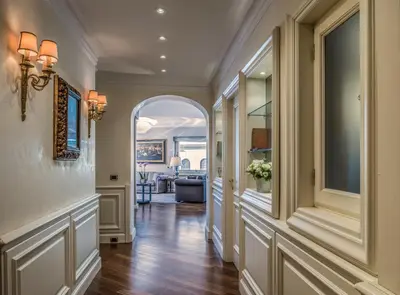 an arched hallway with an archway in a home at 47Luxury Suites - Colosseo in Rome