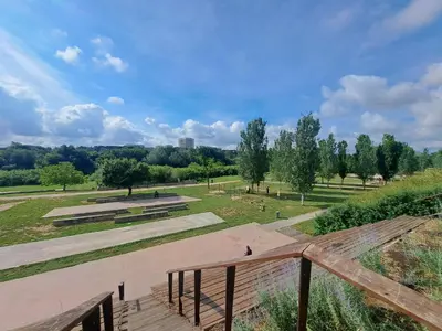 a view of a park with benches and trees at Lacasadirosa in Rome