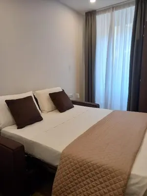 a bedroom with a large bed and a window at Garden Of Vatican's in Rome
